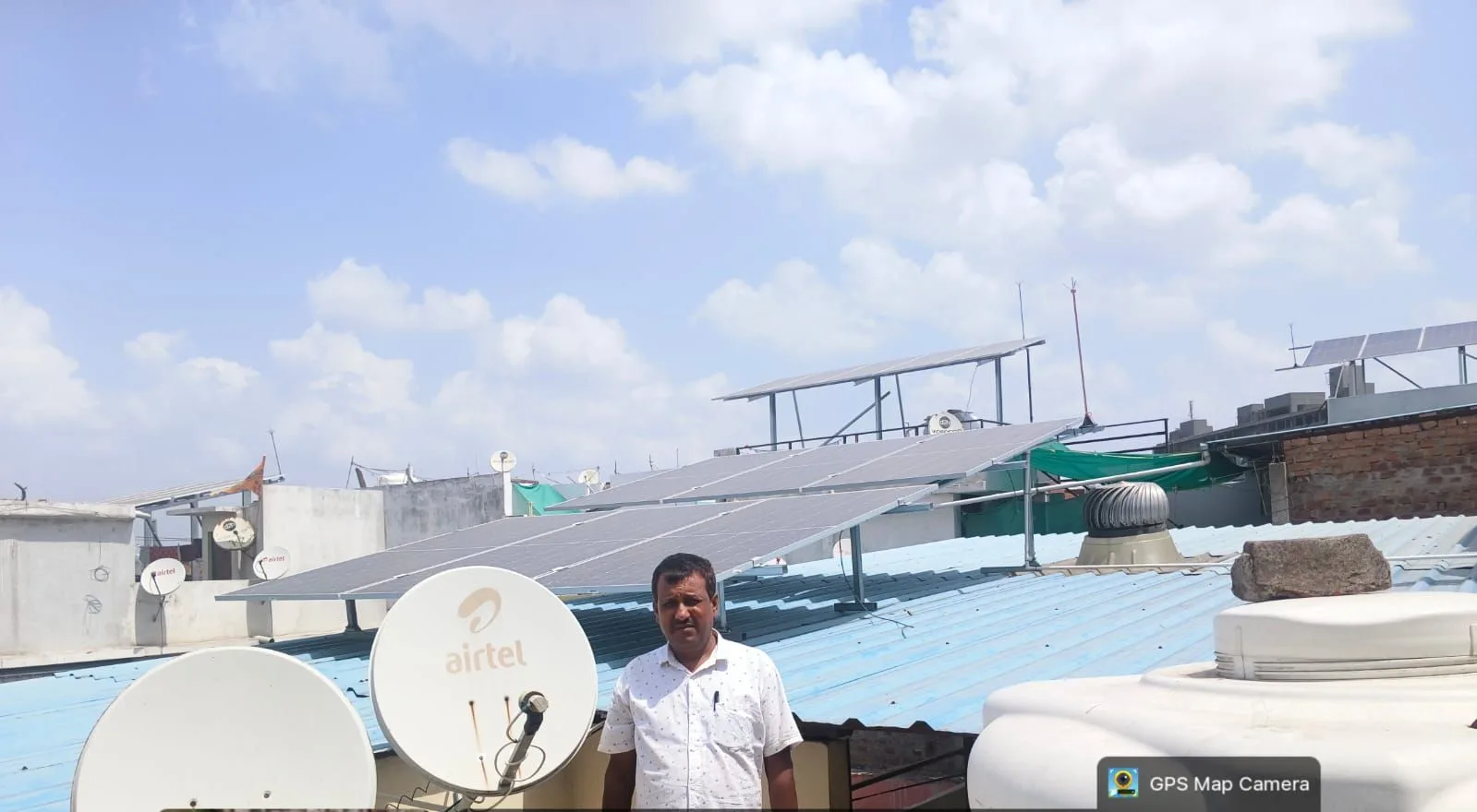 Solar array on a raised frame above a residential terrace in Sukhliya, Indore